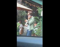 Guy brown puppy dog carrier backpack phone 