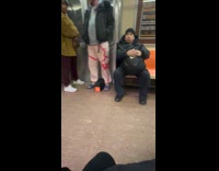 Man wear slides inside the cold subway