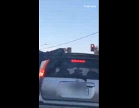 Cup of coffee left above  grey car