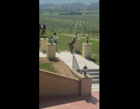 2 women pose their butt to camera at winery 