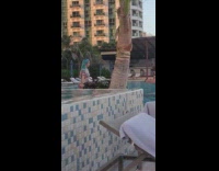 Woman blue hair tiktok dance tree swimming pool