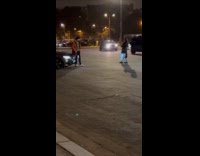 Man poses beside car Eiffel tower behind