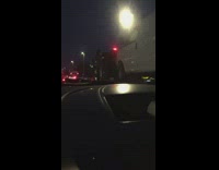 Semitruck with white van in the back drives with no driver in seat 