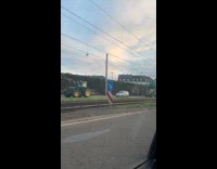 Farmers ride tractor on road for protest