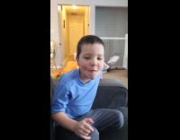 Boy plays with lips make funny sound