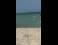 Girl blue bikini hold twintail hair beach