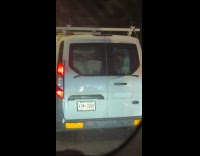 Inverted wipers moving behind van