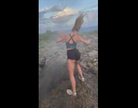 Woman black shorts blown up by wind