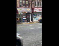 Lady wipes shoes on the sidewalk ground 