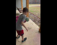 Little kid attempting globetrotter dribble move