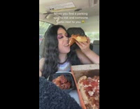 Woman puts food away in car 