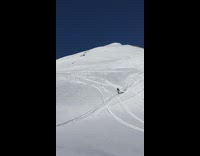 person in yellow back flip ski fail