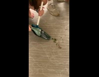 Guy using portable vacuum wrong way 