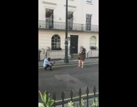 Woman skin tight dress street lamp pole