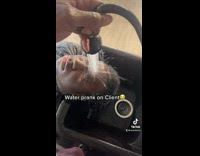 Barber sprays water on clients face prank 