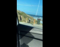 Collab IITW - Woman black leather corset poses at beach Part 2