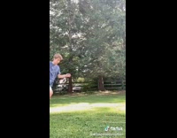 Blue shirt guy backflip changes shirts grass