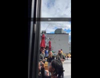 Wind flipped over bar tent at rooftop