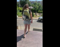 Girl green backpack black white cat stairs 