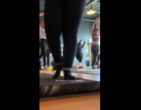 Small puppy humps woman in yoga class