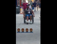 Collab WINY - Man use feet push himself on wheelchair