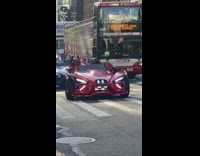 2 guys with masks drives a Polaris Slingshot 