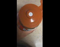 Collab BitchMP - Squeezing orange container until seal breaks shoots out brown liquid