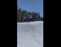 Guy falls after second ramp snowboarding jump trick