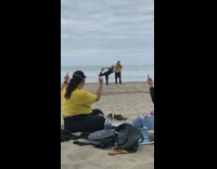 Girls sitting in background middle fingers up 