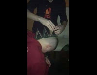 stacking cards on passed out guys head