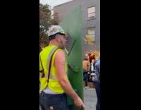 Man dressed as construction worker at parade