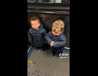 Collab ClipsIG - Kids in Long Coat Rides Elevator Excitedly