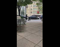 Guy pushes cart with large speaker down street