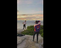 Girl gets on hands kicks legs back 