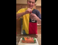 Guy named DaddyDad drinks spiked peach shotgun in kitchen, two bottles of vodka and peach drink