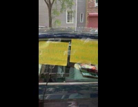 Signs taped to car scold rude driver