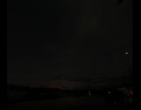 Sun rises from night sky time lapse