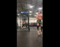 Two guys WAP dance indoor gym dog 