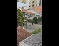 Guy walk street flip black trench coat