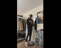 Guy black outfit taking selfie in room 