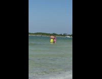 Guy yellow shorts show back muscles beach 