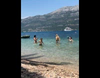 Woman bikini poses with kids near them