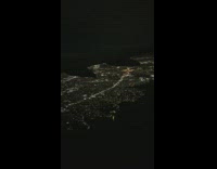 Airplane view pass over NYC night lights