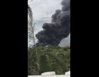 Large black smoke from the fire at the forest