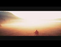 Drone flies over grass during sunrise mountain 