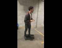 Guy rides on flat dolly falls