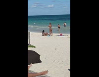 Woman in bikini lie down on the beach