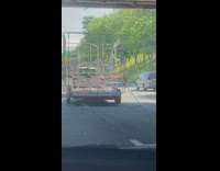 Truck drives with metal bar dragging behind