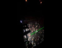 2 people performing with laser lights from butthole 