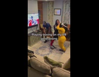 Woman playing VR steps on laptop and breaks it